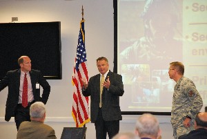 Joining together at the September symposium are (l-r) Paul Finley, mayor of Madison City; Rex Reynolds, deputy mayor of Huntsville; and Col. John Hamilton, USA, commander of the Redstone Arsenal Garrison.
